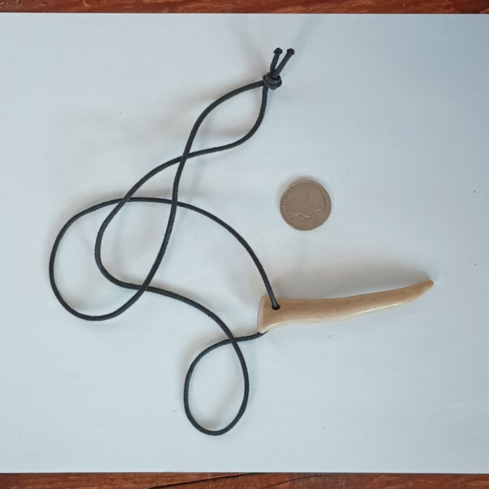Genuine deer antler on a cord